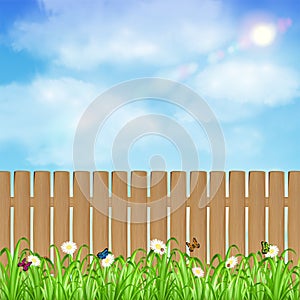 Wood fence with grass flower and sky background