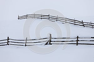 Wood fence in snow. Minimalistic winter landscape