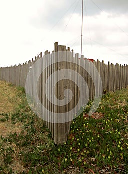 Wood fence in a triangular shape in the beach