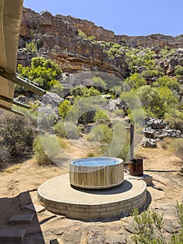 A wood fired hot tub in open countryside in the Cederberg region of South Africa