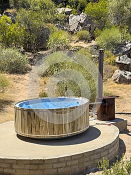 A wood fired hot tub in open countryside in the Cederberg region of South Africa