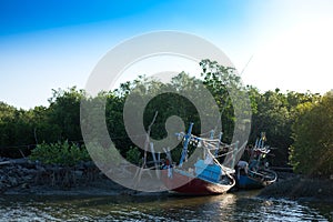 Wood fishing boat anchor on beach get ready for trawl. around th