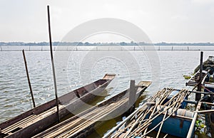 2 Wood Fishing Boat or Rowboat on Swamp with Wood Boat Pole