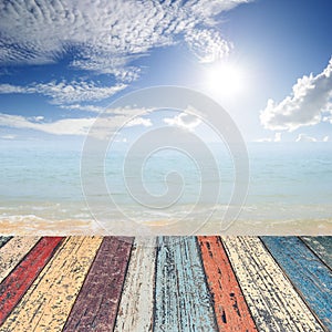 Wood floor on beach sea and blue sky for background