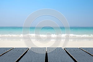 Wood floor scene of beautiful blue sky over sea beach. Summer holiday relax background with copy space for decorate design