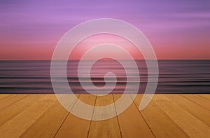 Wood floor on sea with purple sunset Burning Skie beautiful natural tropical sea photo