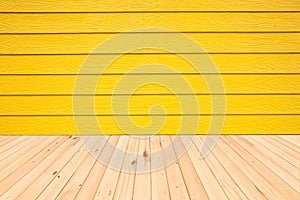 Wood floors and wood wall surface yellow background.