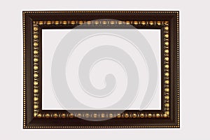 Wood frame brown trimmed golds antique isolated on white backgr photo