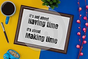 Wood frame, clock and coffee mug on blue and yellow background.
