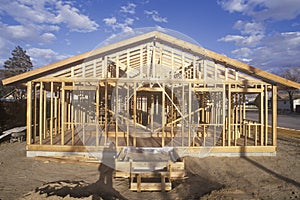 Wood frame of house under construction, Lone Pine, CA