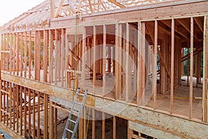 Wood frame residential building under construction framing new home