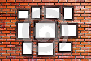 Wood frames photo on red brick wall