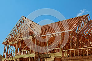 wood framework of new residential home under construction.