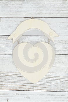 Wood heart sign on weathered whitewash textured wood