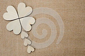 Wood hearts on hessian texture background photo