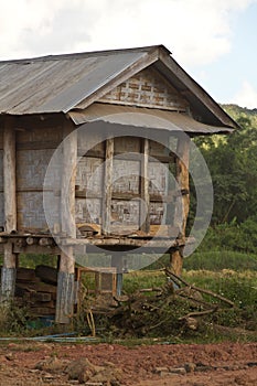Wood hut for storage of rice straw in countryside of Laos