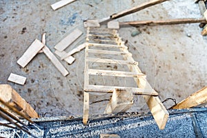 Wood ladder on construction site, tools and concrete renovation