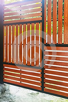 Wood lath wall decoration made by brown shera wood boards, vertical and horizontal slim lines pattern design, backdrop design.