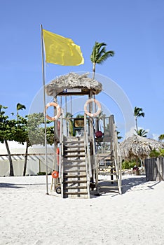 Wood lifeguard station on a white beach