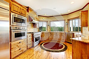 Wood luxury home kitchen interior. New Farm American home.