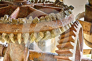 Wood and Metal Cog Wheels Connected Together in One Design Mechanism Used for Grain Grinding