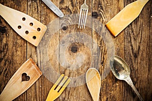 Wood and metal utensils, wooden table.