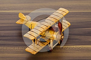 Wood model airplane on desk