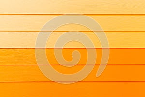 Wood orange background.orange Synthetic wood wall texture use for background.Colorful wooden board painted in orange.