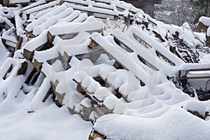 Wood and palets under the snow photo