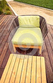 Wood patio lounge chairs with green cushions