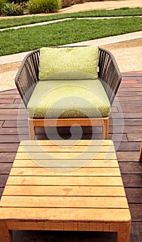 Wood patio lounge chairs with green cushions