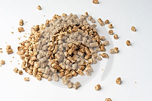 Wood pellets isolated on white background. Biofuels. Cat litter