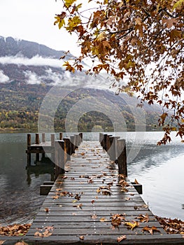 Wood pier on Lake Piano in autumn