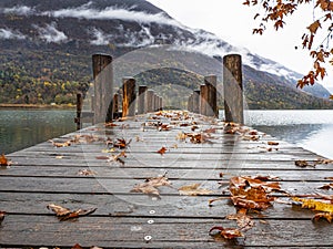 Wood pier on Lake Piano in autumn