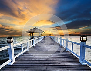 Wood piers and sea scene with dusky sky use for natural background ,backdrop