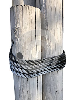 Wood Pilings tied wit a rope on a white background