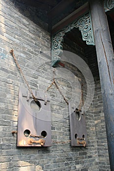 wood pillories in an old mansion (the former seat of the government) in pingyao (china)