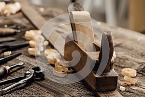 Wood planer on the carpenter`s workbench