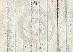 Wood plank fence with an old paint white color close up. Detailed background photo texture. Wooden wall abstract background.