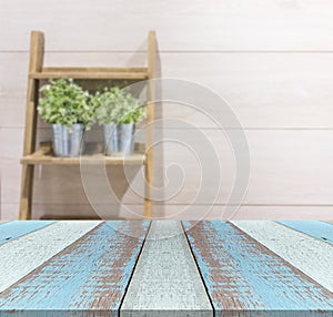 Wood plank or table top with flowerpot on the stair with wood laminate background.