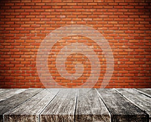 Wood plank tabletop, with defocus brick white wall texture background photo