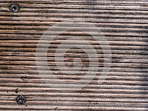 Wood plank texture background with screws on the left side