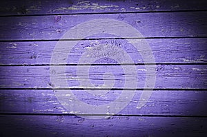 Wood planks, old purple paint peeling off background texture