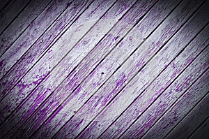 Wood planks, old purple paint peeling off background texture