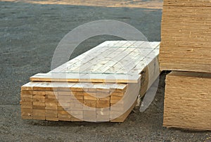 Wood planks stacked on construction site