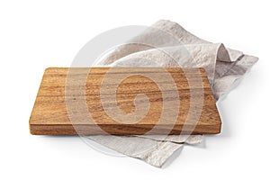 Wood plate on linen napkin isolated on white background