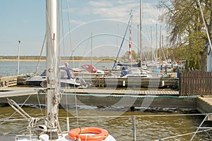 Wood platform beside yachts at marina. yacht club. yachts moored at the pier