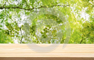 Wood podium table top floor outdoors blurred fresh green tropical forest tree nature background.Organic healthy natural product