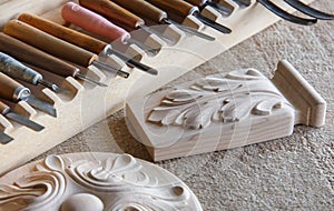 Wood processing. Joinery work. wood carving. the carving object with pattern, chisels for carving close up. small depth of field.