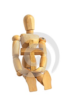 Wood Puppet Man Sit Down Holding Simple Wood Cross. Adjustable Wood Doll Mannequin on iSolated White Background